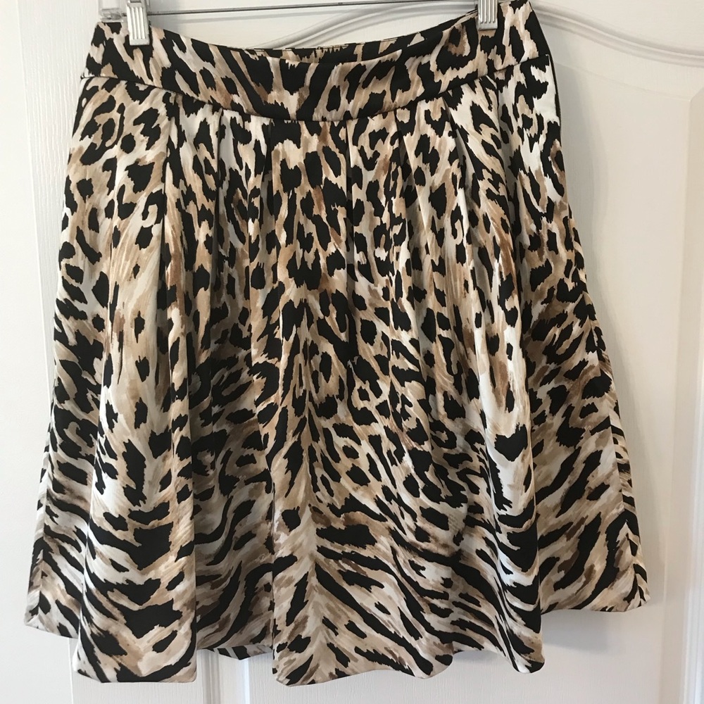 On trend for Fall 2024 style, White House Black Market animal print skirt